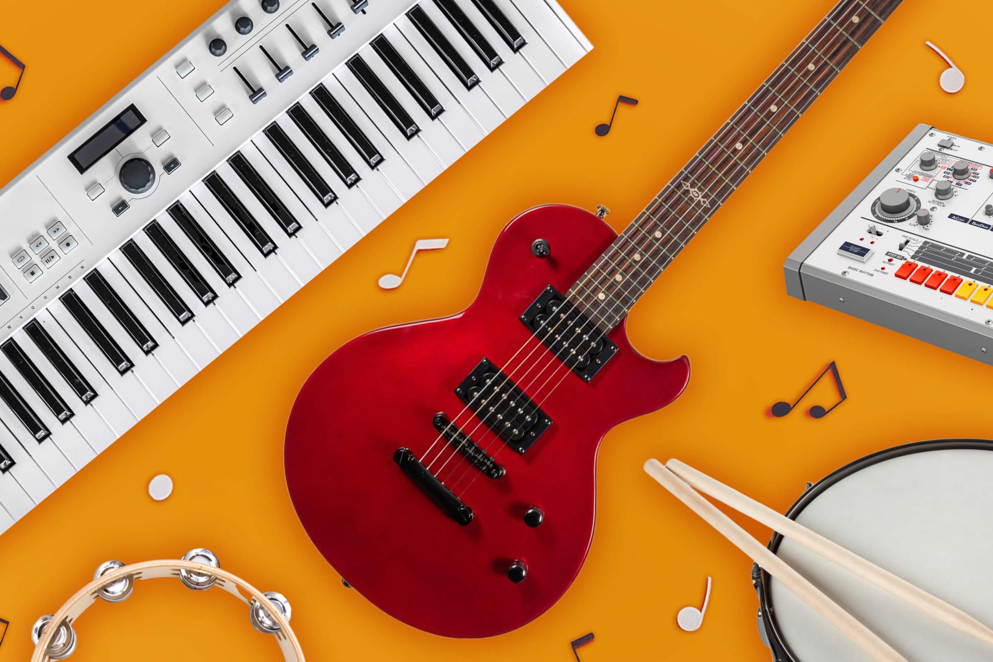 Red electric guitar, keyboard, and drumsticks on an orange background